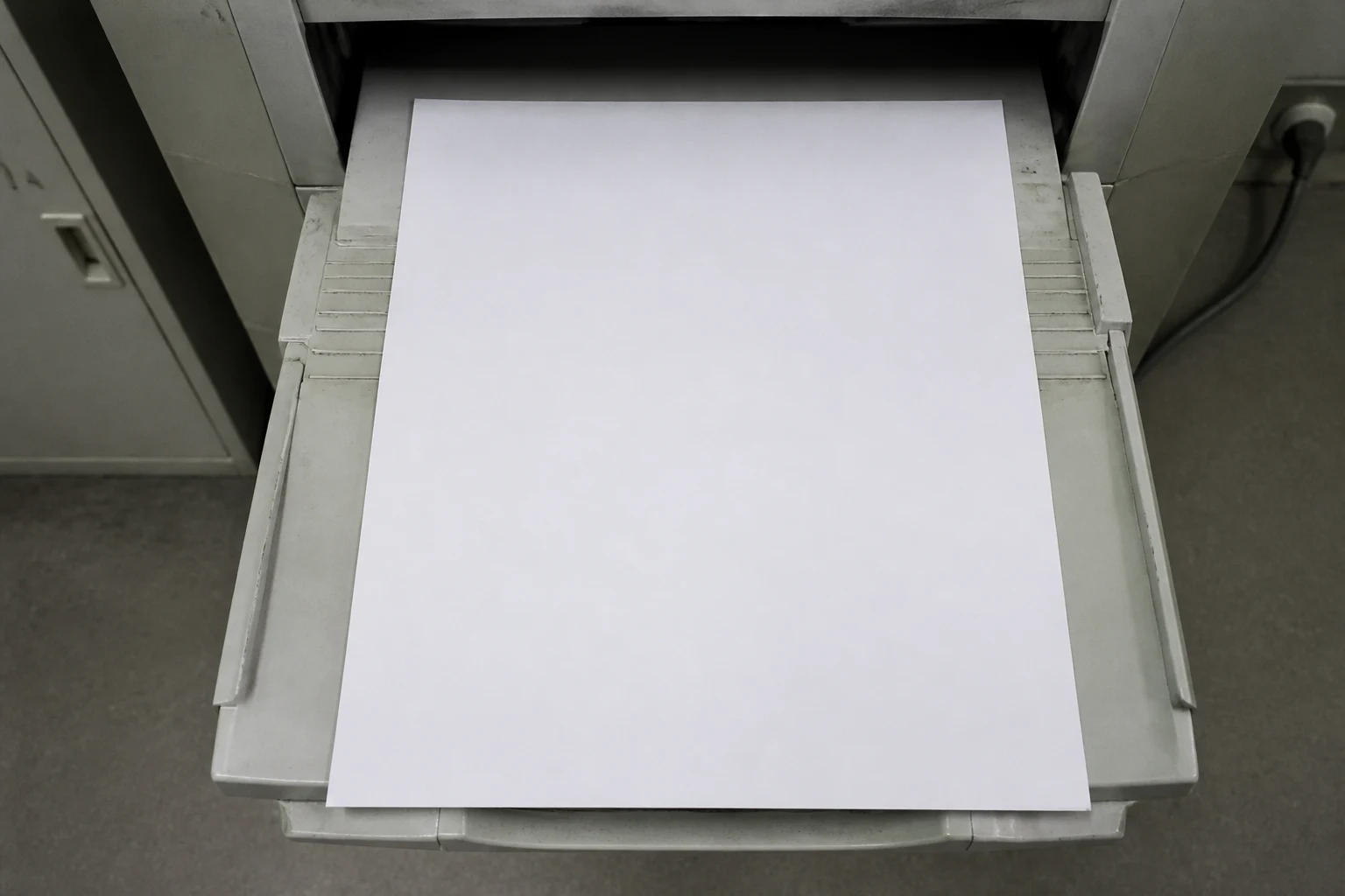 A sheet containing an unauthorized corporate haiku in an office printer output tray